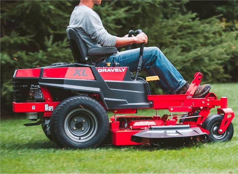 Male homeowner maintaining his lawn with a robust riding mower.